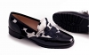 Dupon model shoe, made in black patent leather and black-white cow
