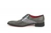 Modèle de chaussure Metalicy, en cuir verni gris et plomb gris.